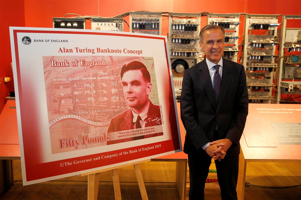 Bank of England governor Mark Carney presents the image of mathematician Alan Turing, which will...