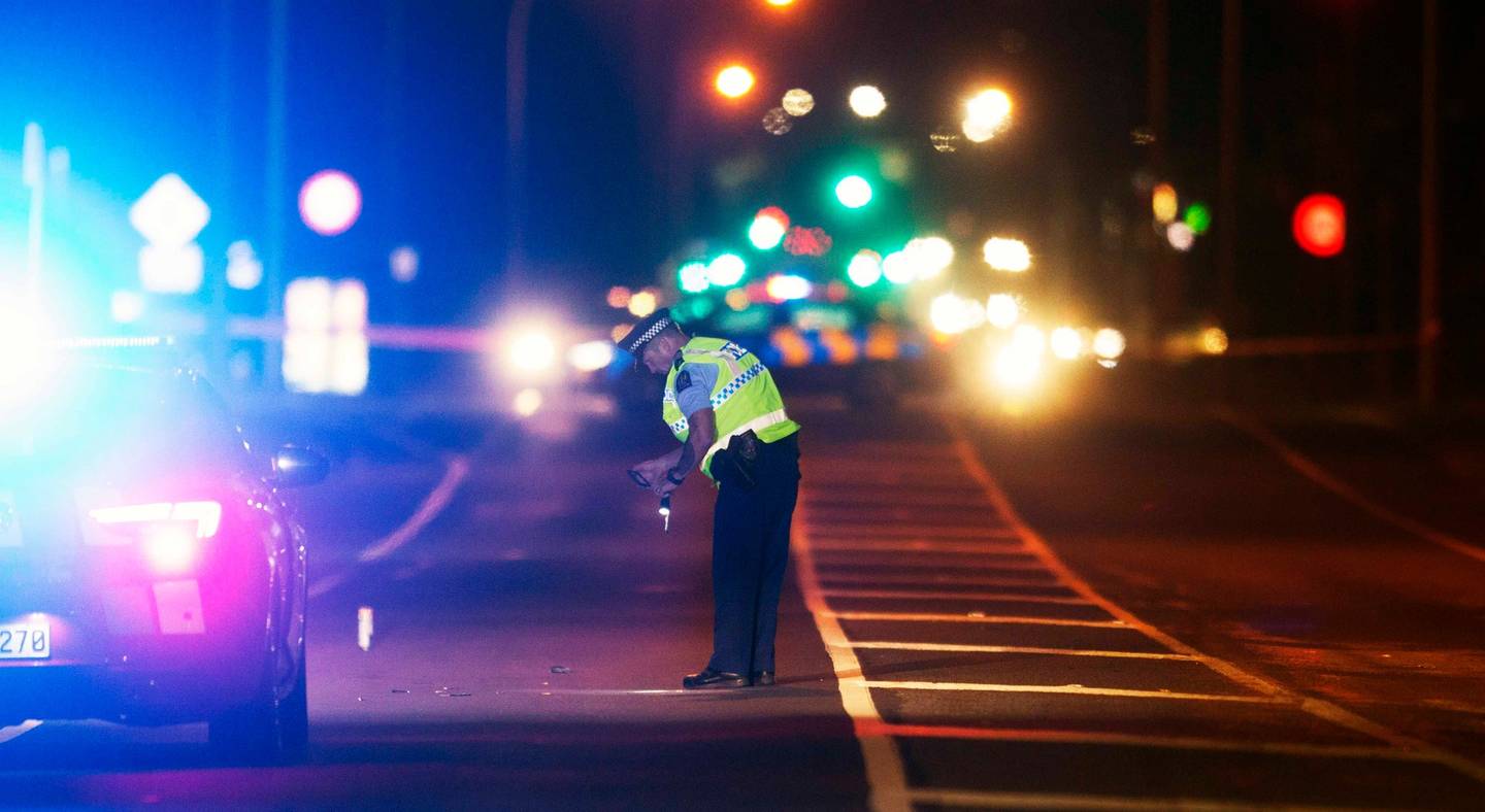 Police investigate the crash scene on Te Ngae Rd where a pedestrian was hit by a car. Photo: NZME