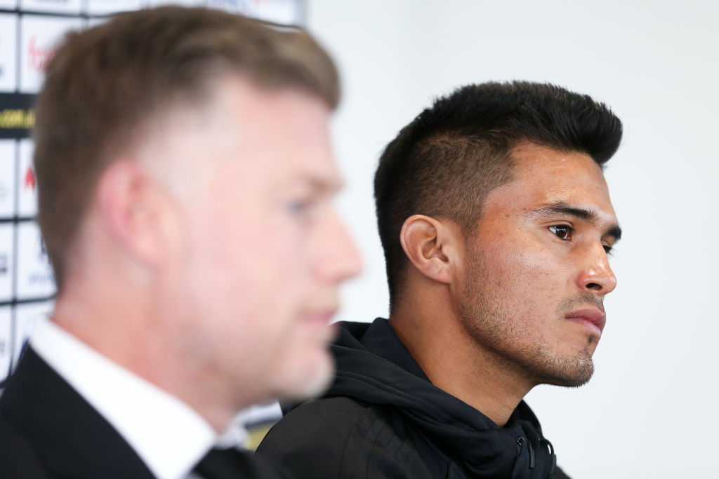 New signing Ulises Davila (R) and coach Ufuk Talay speak to media during a Phoenix press...