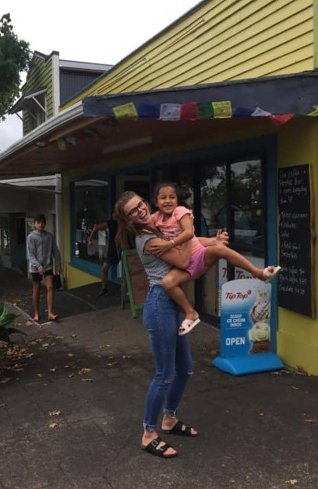 Medea Goodwin with a young customer outside her business, Hokianga Takeaways. Photo: Supplied