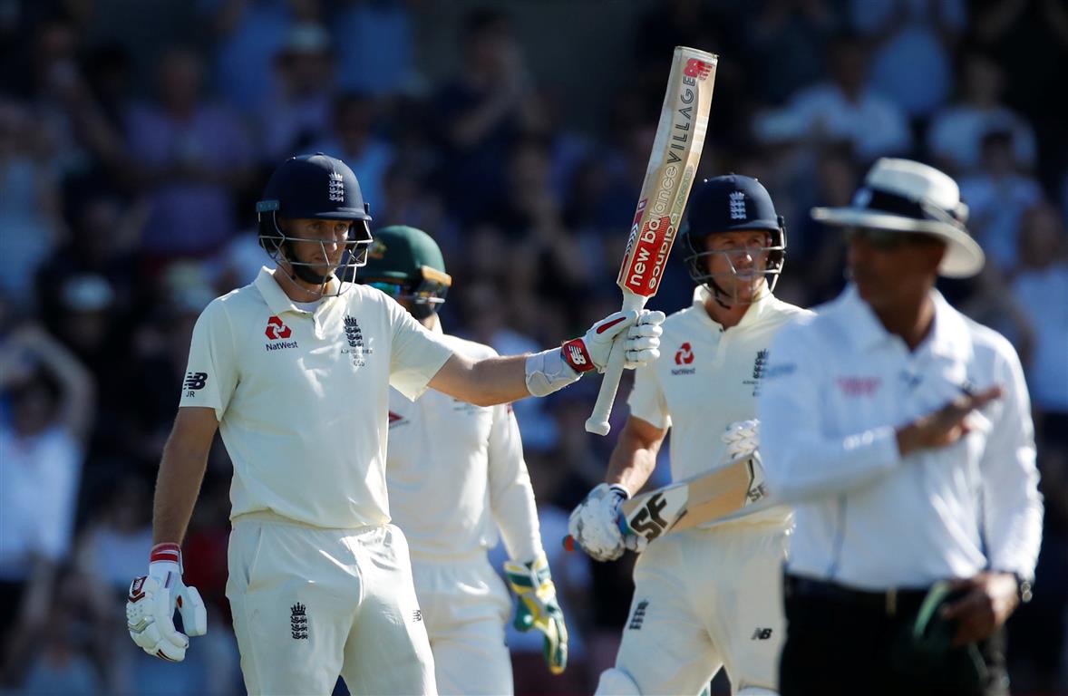 Joe Root celebrates reaching his half century. Photo: Reuters