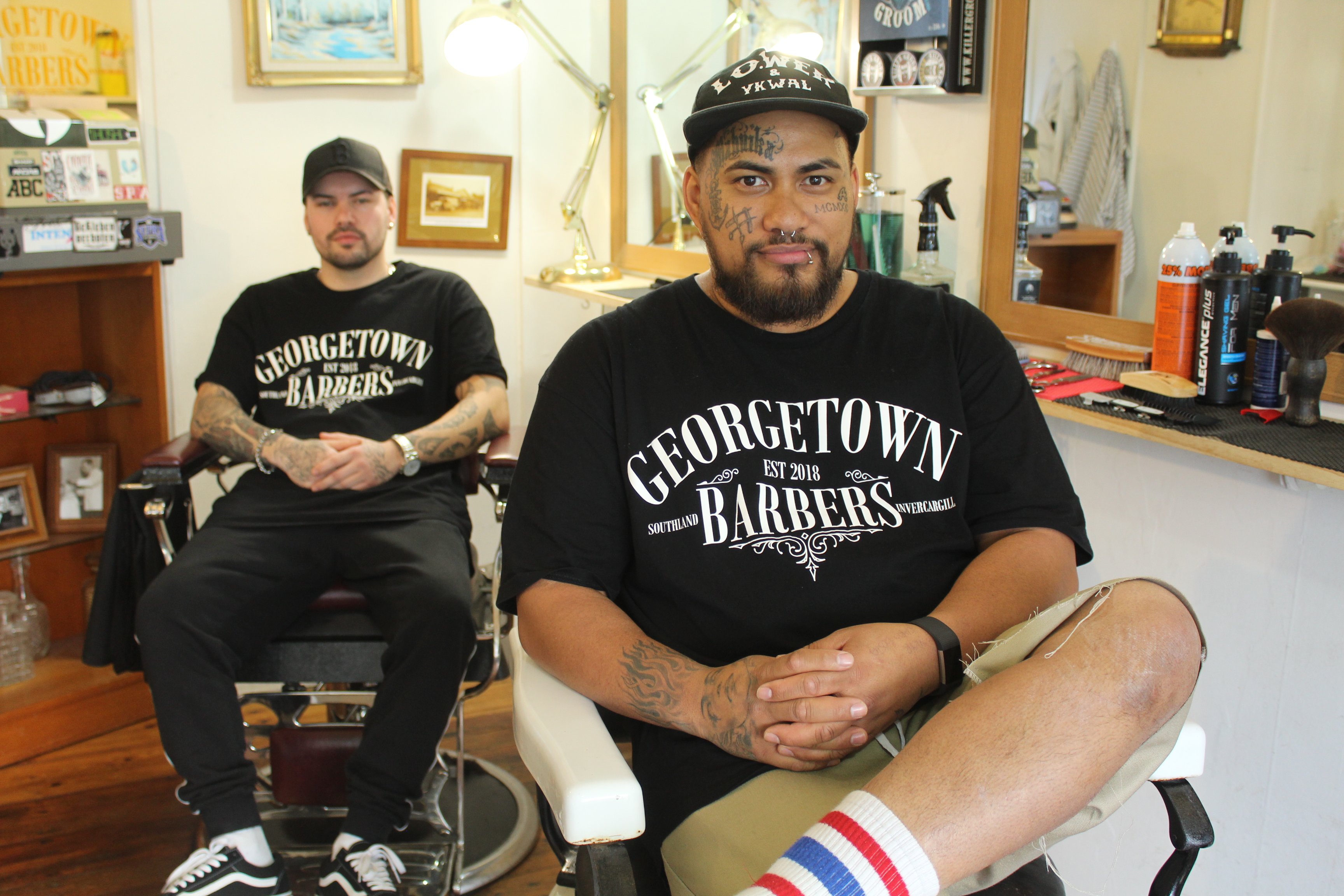 Fast-tracking success: Georgetown Barbers employee (left) Nate Walters with owner and friend Niko...