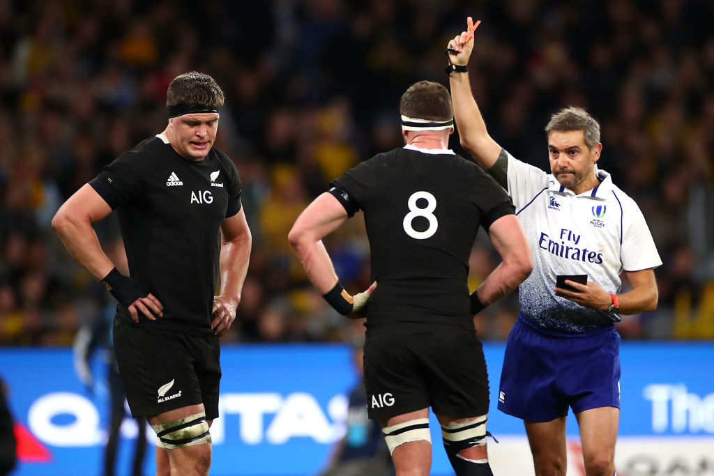 Scott Barrett (left) is shown the red card for dangerous play against Wallaby Michael Hooper....