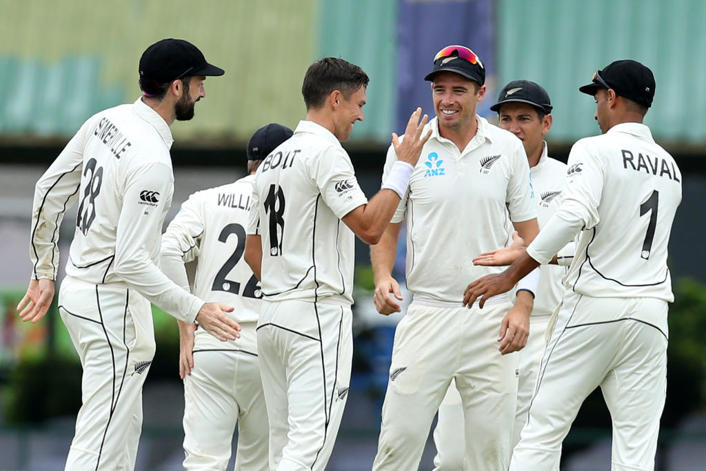 New Zealand's Trent Boult (C) celebrates with teammates after taking the wicket of Sri Lanka's...