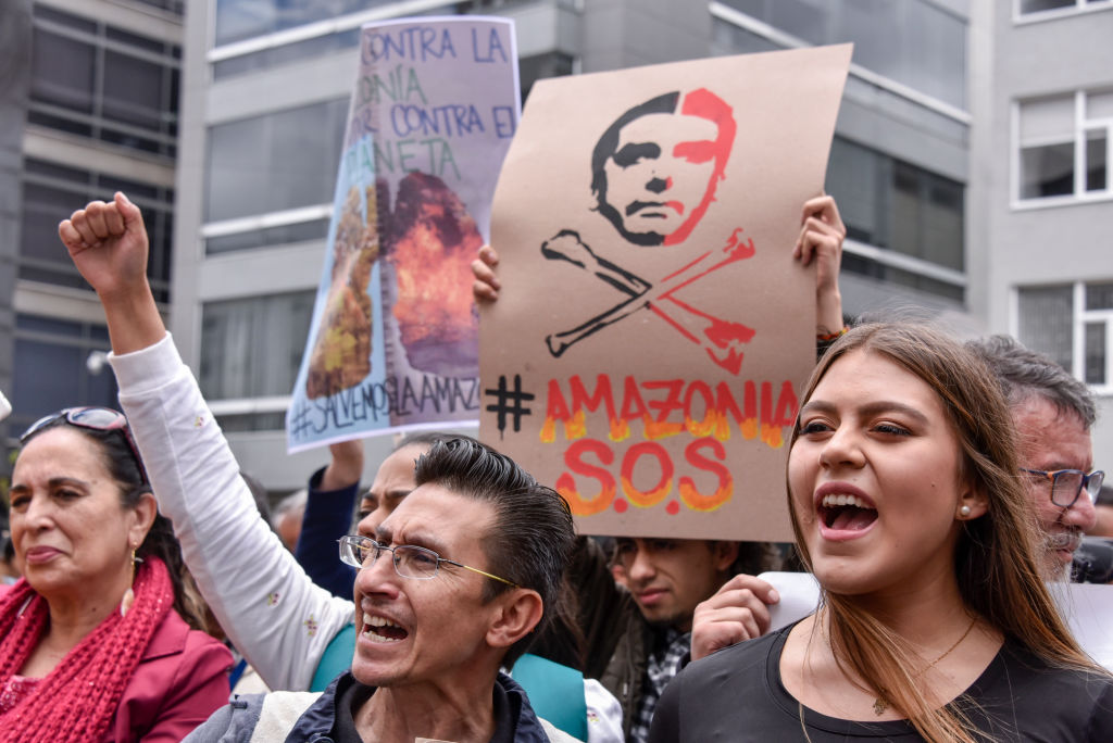 Protesters in Bogota, Colombia, take part in a rally in response to the Amazon rainforest fires....