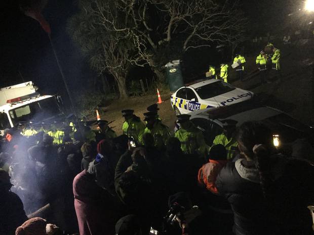 Police hold the main protest group apart from the advance guard at Ihumātao. Photo: NZ Herald