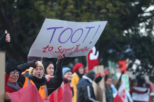 Protesters outside the Fletcher Building in Penrose. Photo: NZ Herald