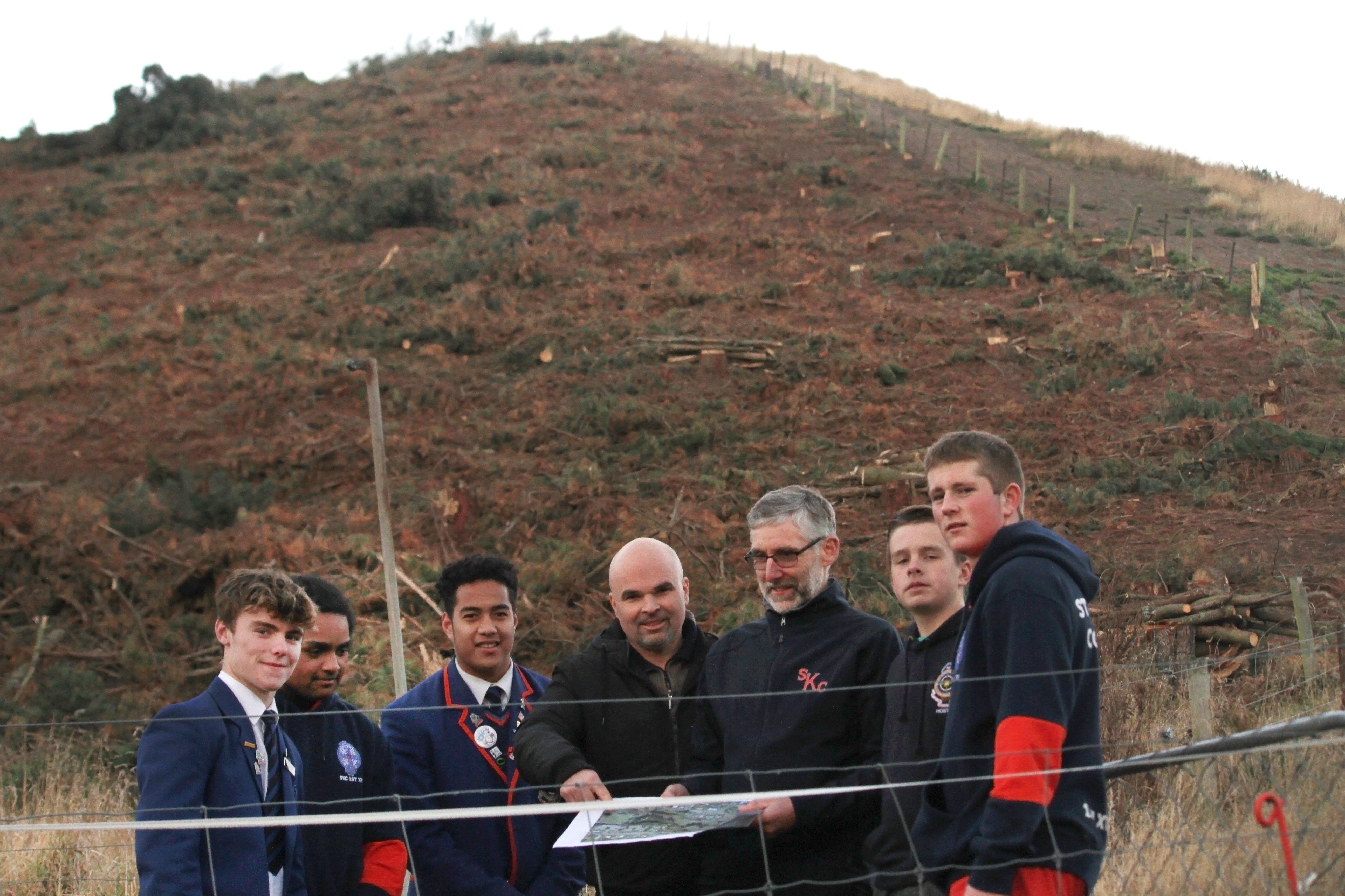 St Kevin’s College pupils (from left) Marc Boardman, Tai Williams and Jerome Misiloi look over...
