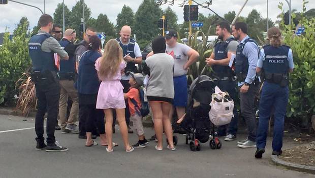 The infamous travellers talk to Police and Immigration officers in Hamilton. Photo: NZ Herald