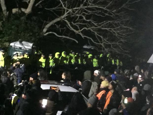 Police stand aside as the United protest group sings a Māori hymn. Photo: NZ Herald