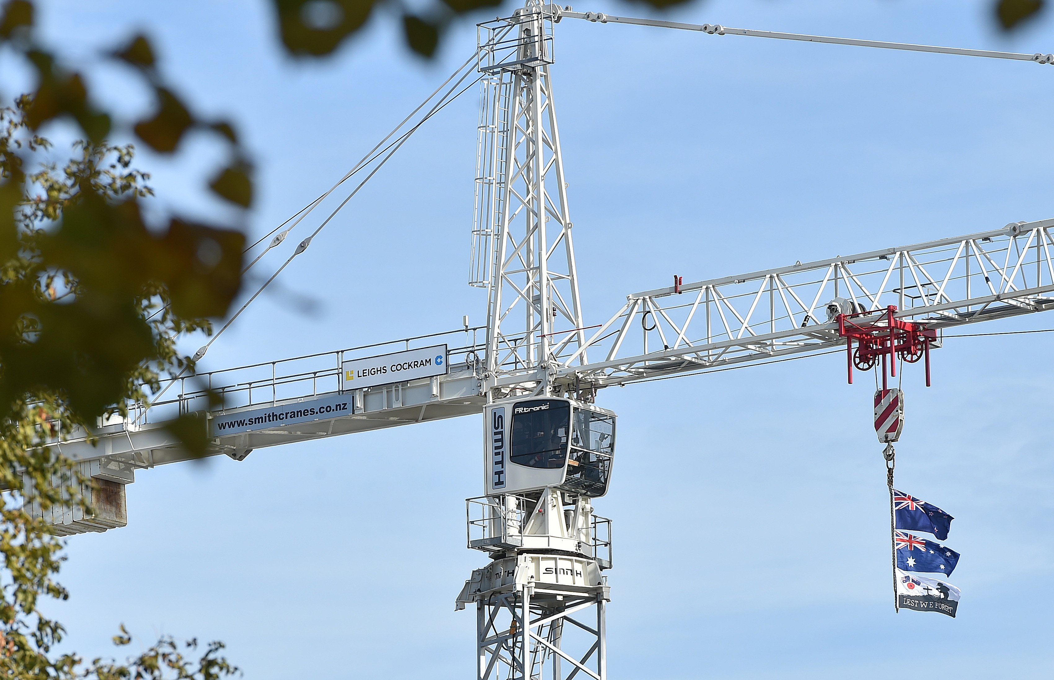 New Zealand and Australian flags fly from the crane invoved in the construction of the Dental School in Dunedin on Anzac Day. PHOTO: Gregor Richardson