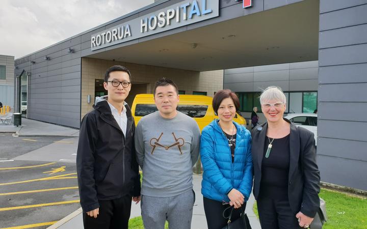 Robert Liu (2nd left) and Rotorua Mayor Steve Chadwick (right) with local volunteers from the...