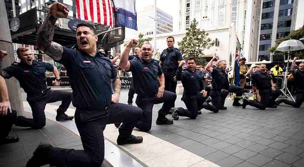 Firefighters perform a haka in memory of first responders to the September 11 World Trade Centre...