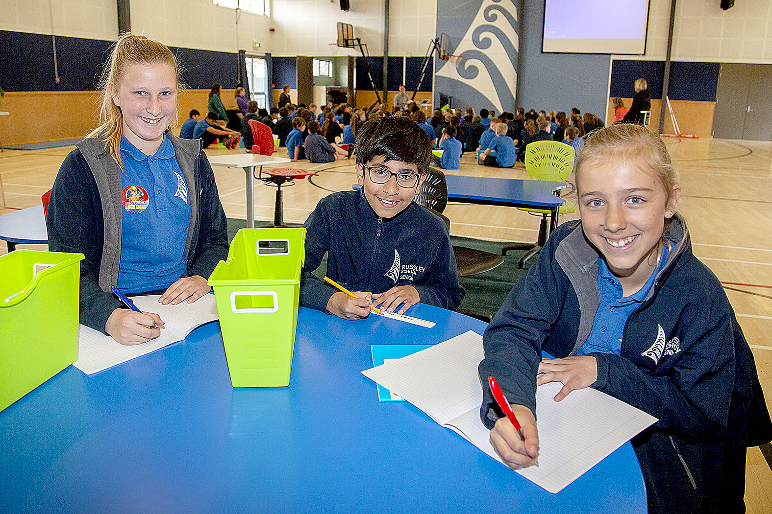 Maddy Hicks, 12, Khizar Abbas 11, and Xanthe Moore, 12 having class in the school hall. Photo:...