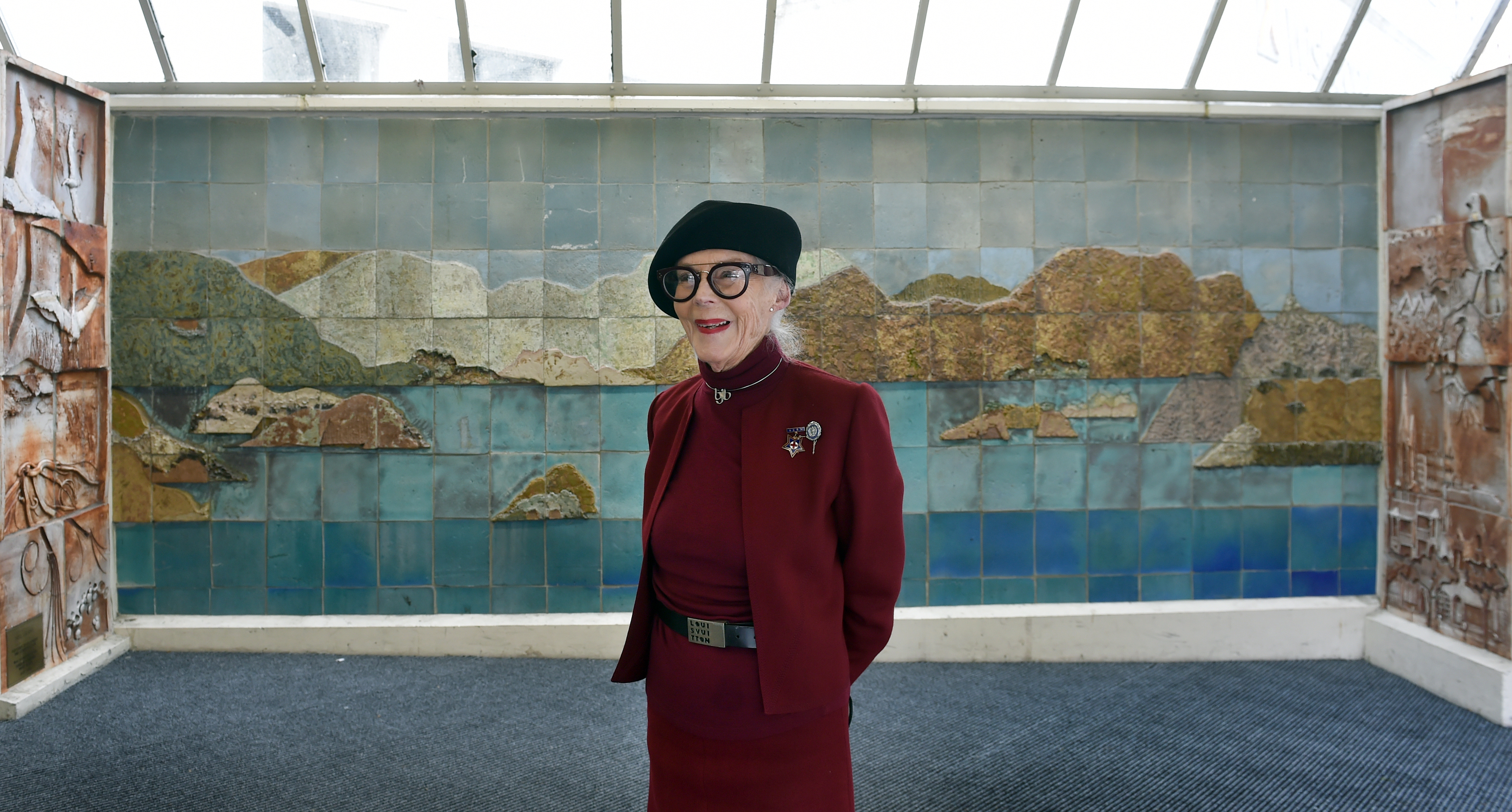 Aesthetic co-ordinator Barbara Brinsley stands in front of a Neil Grant ceramic, one of the larger artworks at Dunedin Hospital, which she wants to see moved to the new hospital. Photo: Peter McIntosh