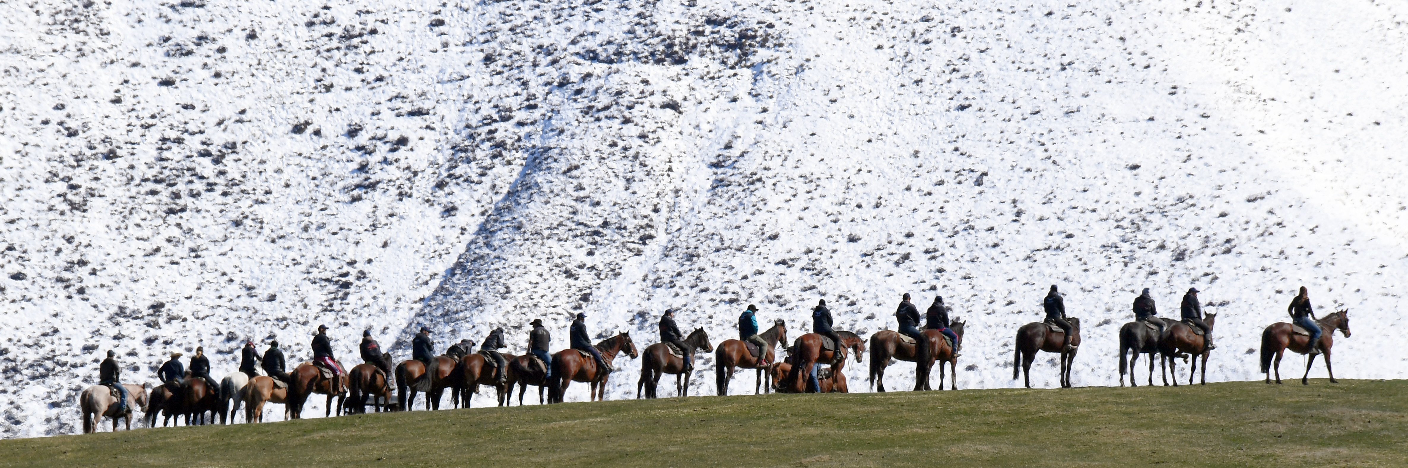 Riders line a ridge near the film set in the Ahuriri Valley. Photo: Stephen Jaquiery