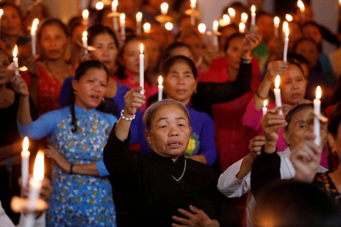 People attend a mass prayer for the victims at My Khanh parish in Nghe An province, Vietnam....