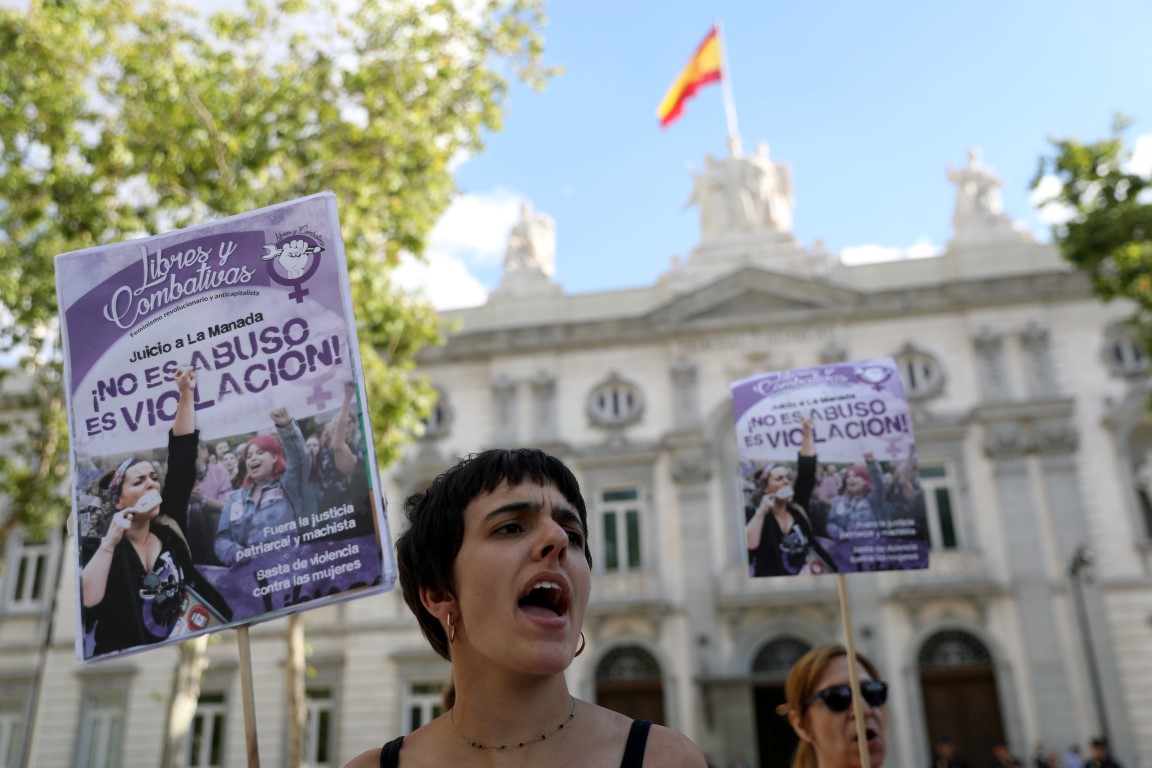 Women gather outside the Supreme Court in Madrid after Spain's top court found five men known as...