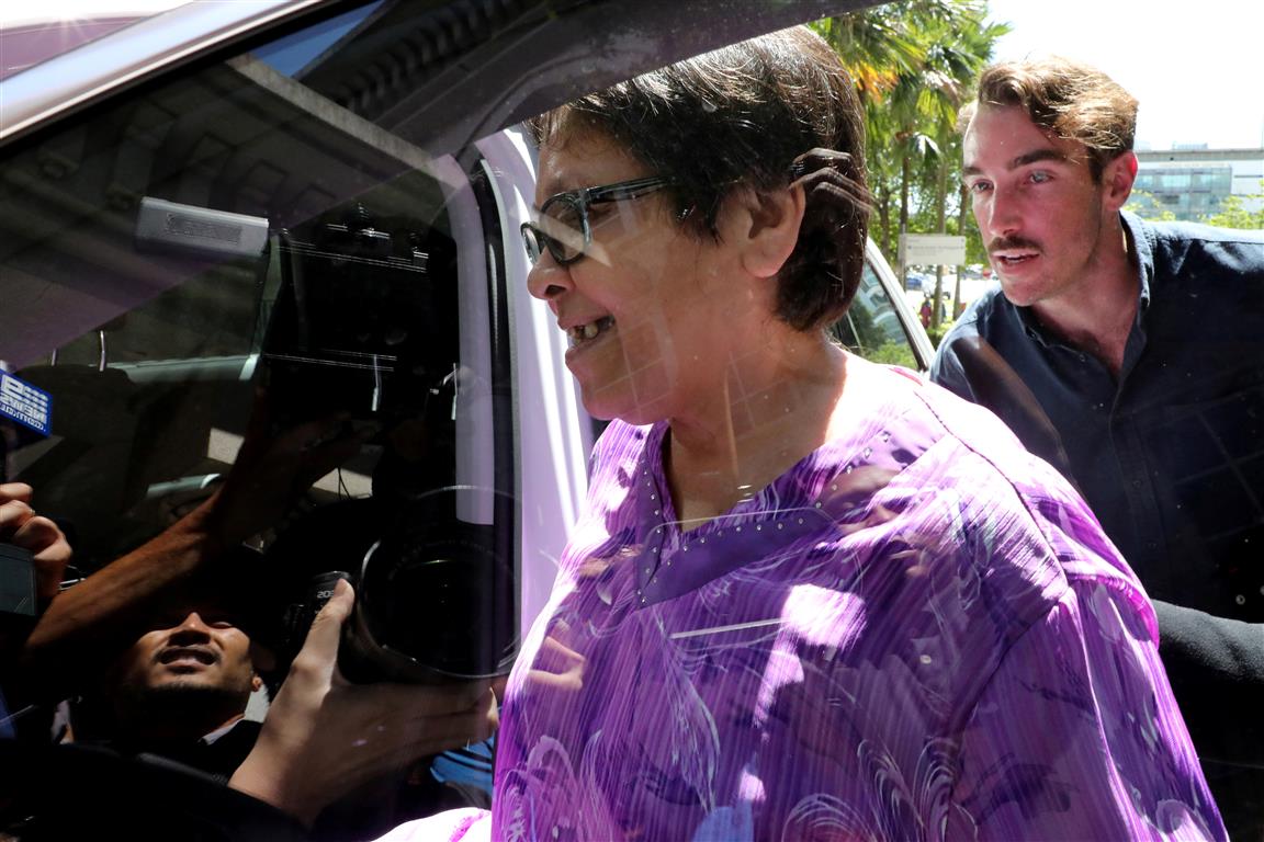 Maria Exposto enters a car after she was acquitted at the Federal Court in Kuala Lumpur. Photo:...