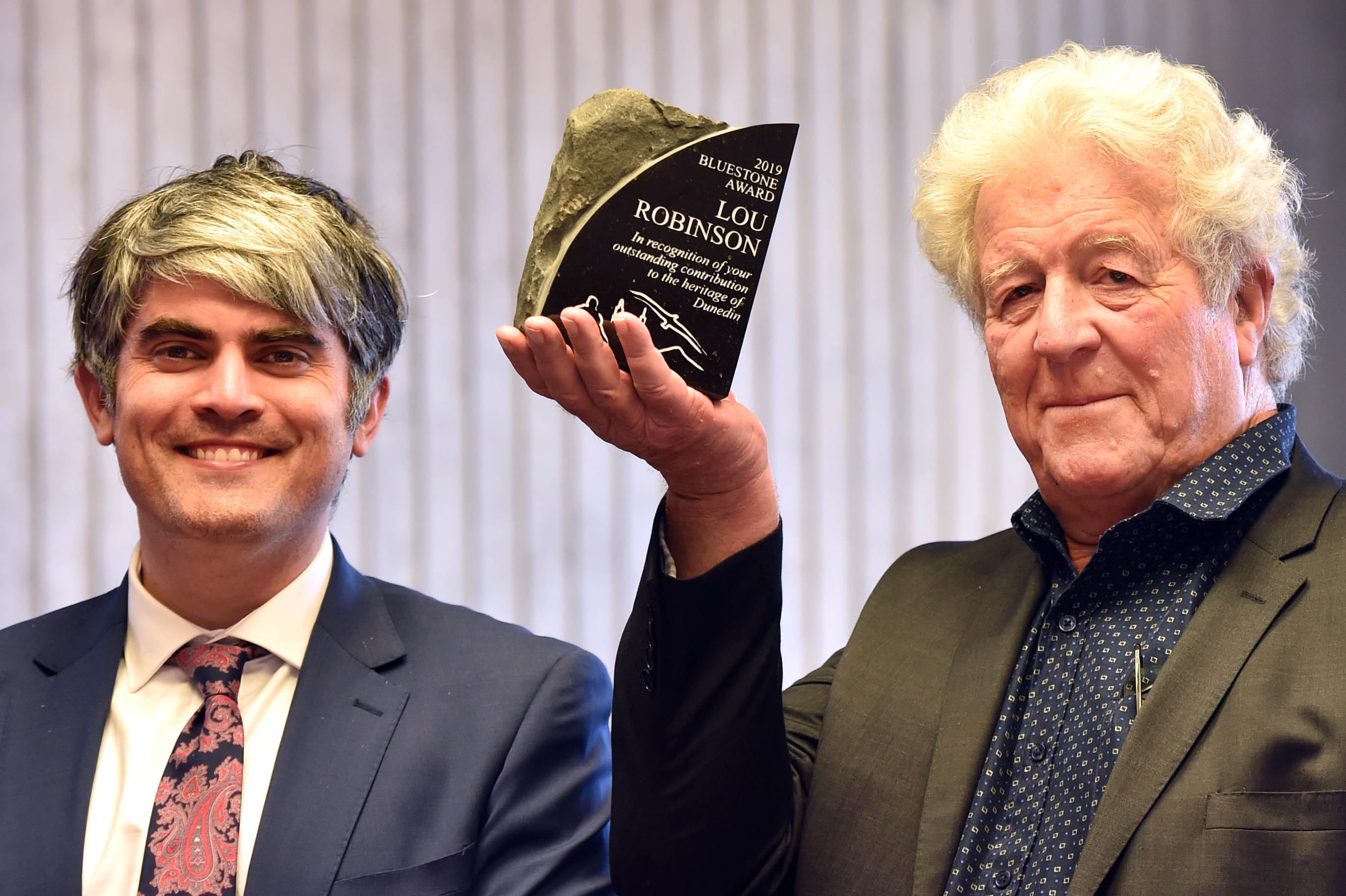 Receiving the Bluestone Award from Dunedin Mayor Aaron Hawkins (left) for his work in restoring and strengthening heritage buildings is Hadley and Robinson director and structural engineer Lou Robinson. Photo: Peter McIntosh