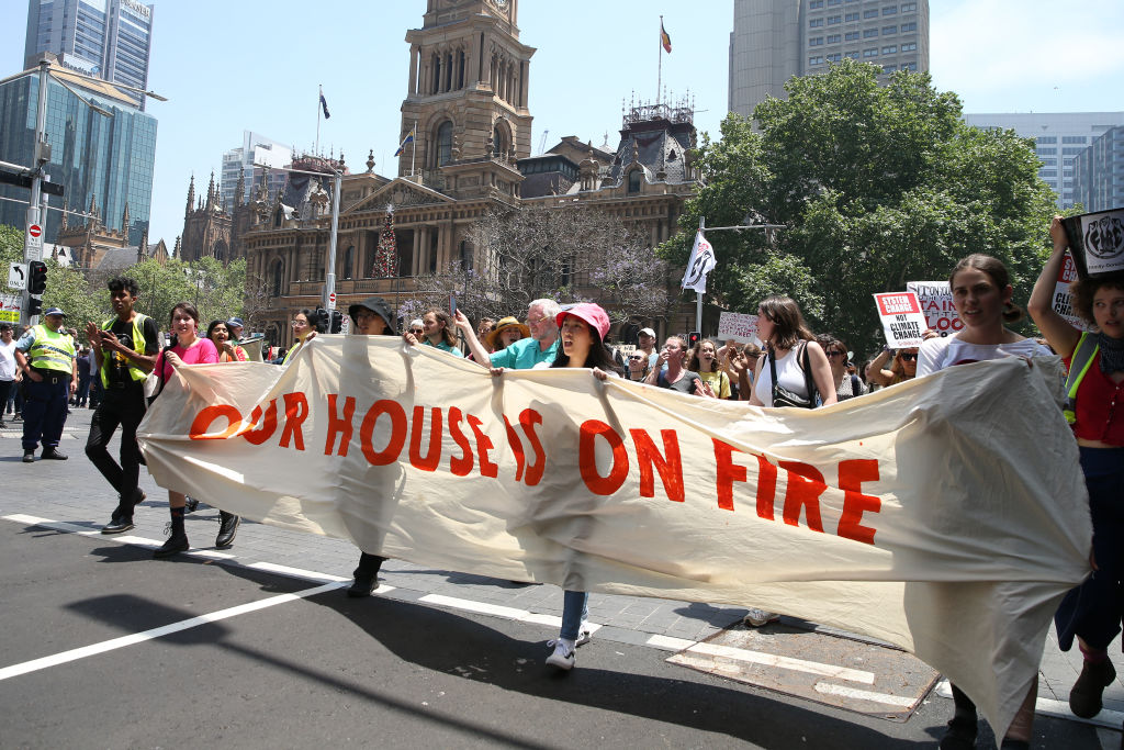 Protesters march through the streets of the Sydney CBD today. Photo: Getty