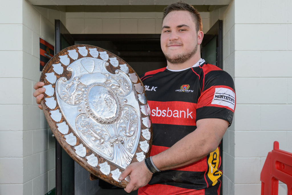 Canterbury's Joel Hintz poses with the Ranfurly Shield following the team's match against Mid...