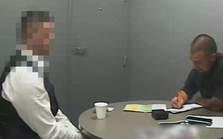 An image taken from video shown to the jury of the defendant being interviewed at Auckland...