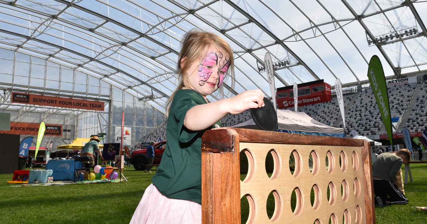 Macy Harmes (4), of Dunedin, plays Connect 4 at the Home and Living Show at Forsyth Barr Stadium...