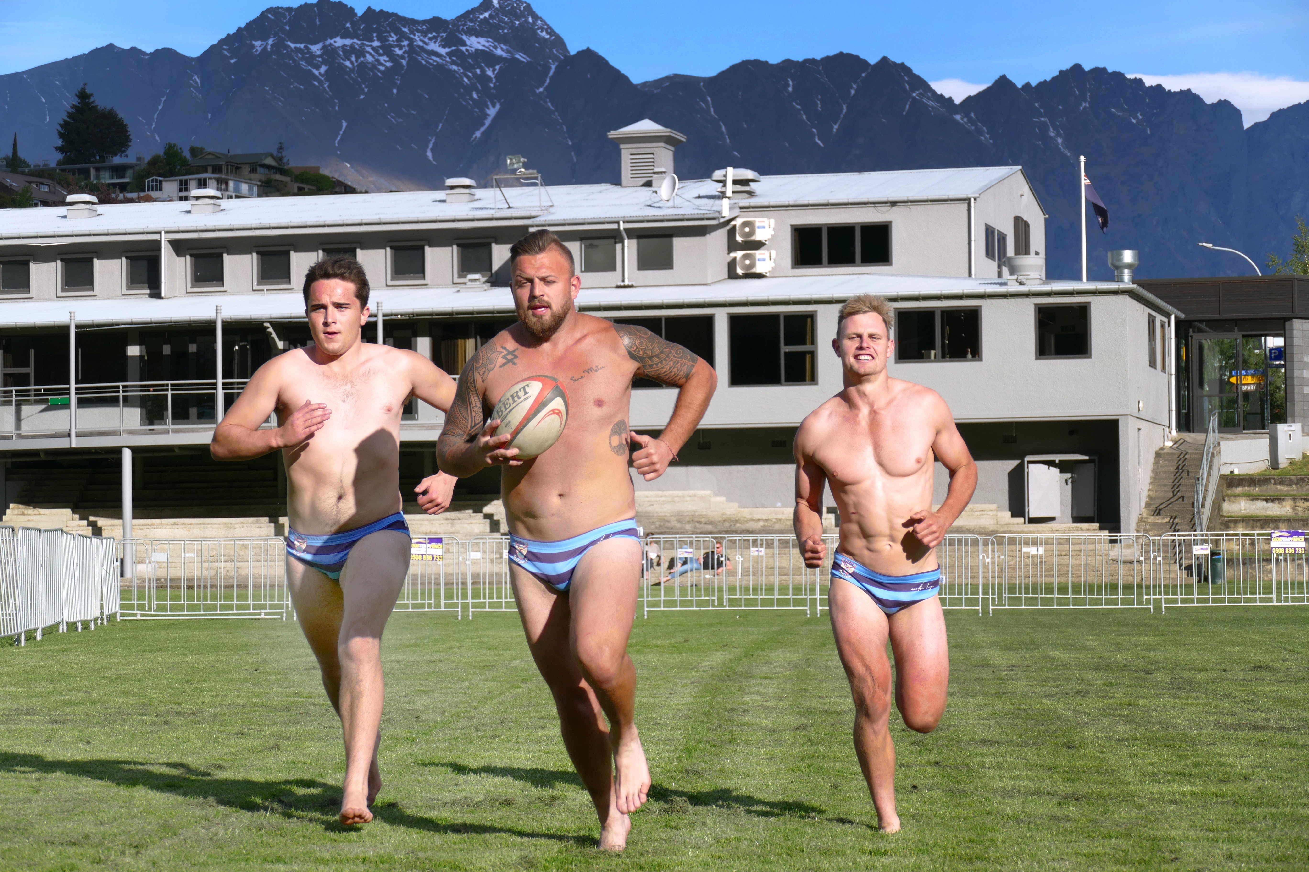 Wakatipu Rugby Club players (from left) Tom Ellis, Rhys Kearton and Logan Beggs stretch their legs before Saturday's Queenstown International Marathon. Photo: Tracey Roxburgh