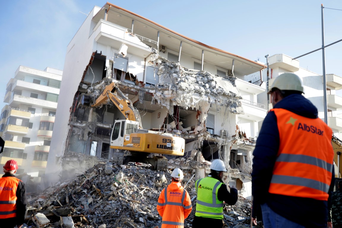 A bulldozer works at a collapsed building in Durres following the earthquake. Photo: Reuters