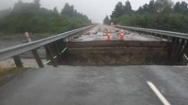 Damage to the Little Man Bridge on State Highway 6 at the height of last week's storm.Photo: NZ...