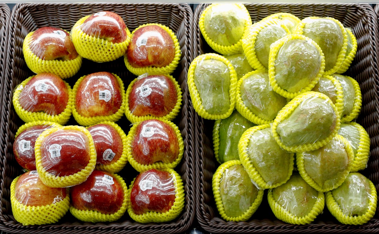 Fruit packaged in plastic on display at a supermarket in Beijing. Photo: Reuters