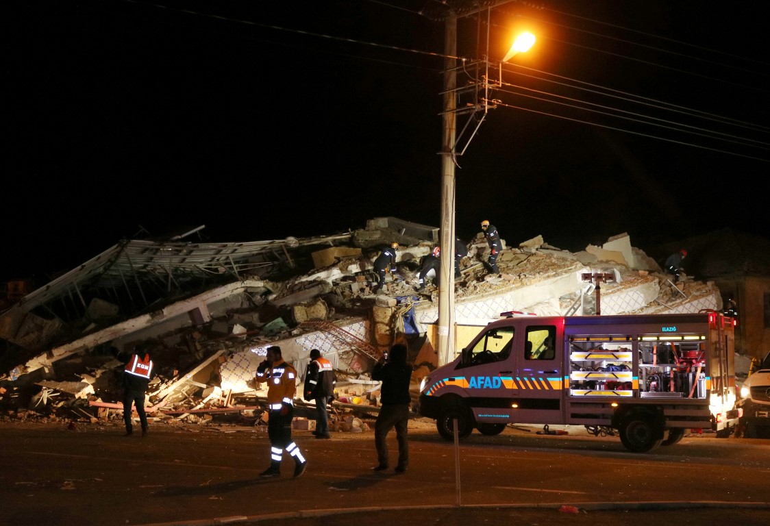 Rescuers work on a collapsed building after the earthquake in Elazig province. Photo: Ihlas News...