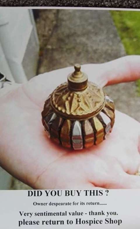 Ngairena Hibbs believes she wrapped this small copper and silver urn in a scarf she had donated...