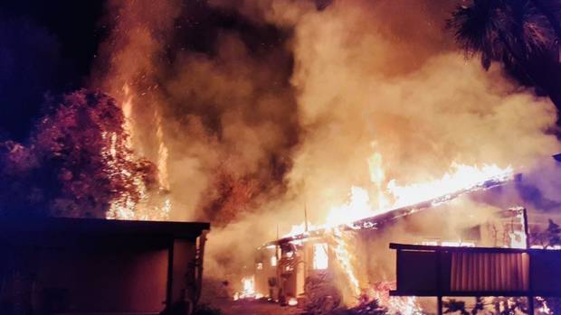 A firefighter was treated for heat exhaustion while battling a massive house fire in Nelson in...