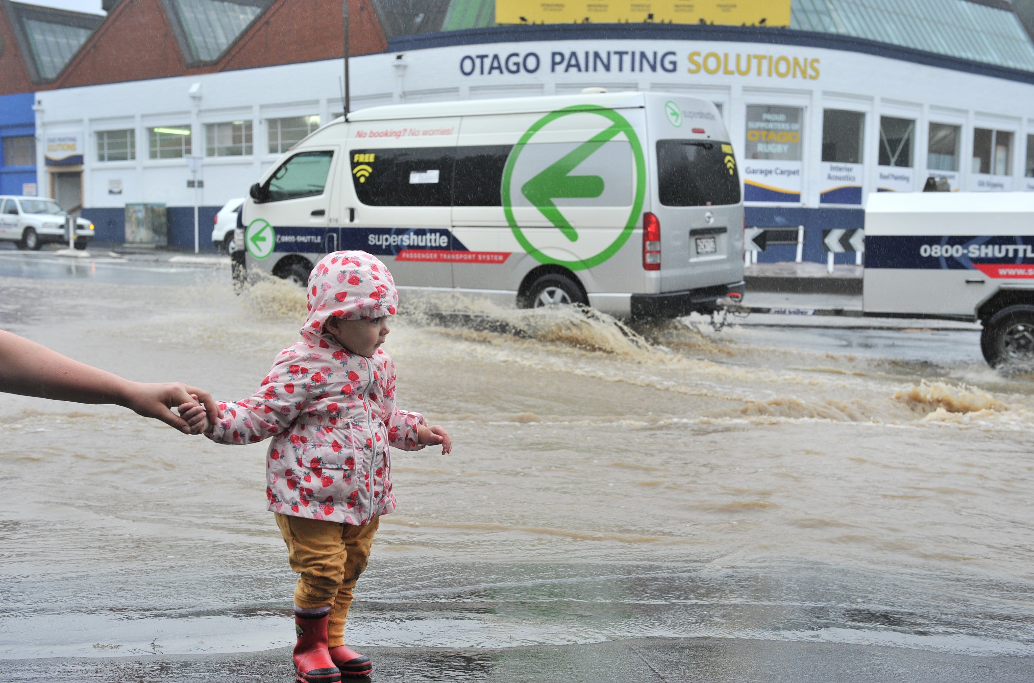 Surface flooding in Kaikorai Valley Road. Photo: Christine O'Connor