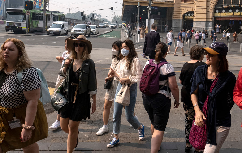 People walking through central Melbourne as the city suffers hazardous air quality on Tuesday....