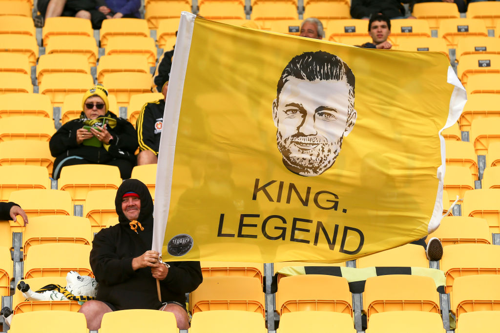 A Phoenix fan shows support for team coach Ufuk Talay during their match against Western Sydney...