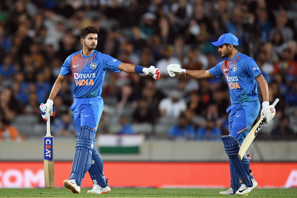 India's Shreyas Iyer (L) and Manish Pandey bump fists during the match against New Zealand. Photo...