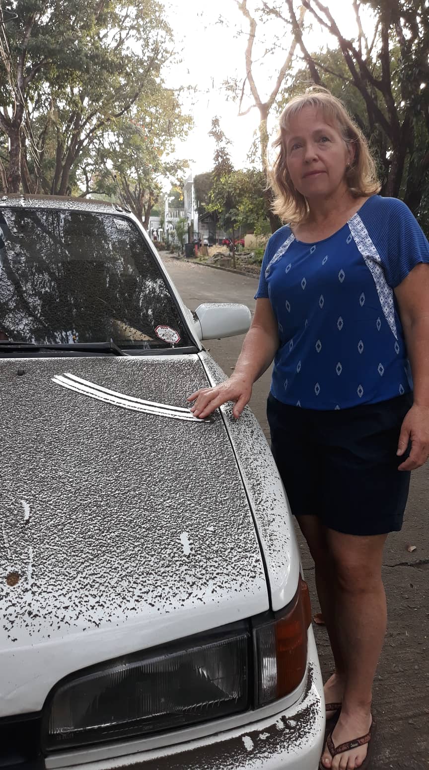 New Zealander Sonia Winslade (pictured) says ash spewing from Taal Volcano is coating their...