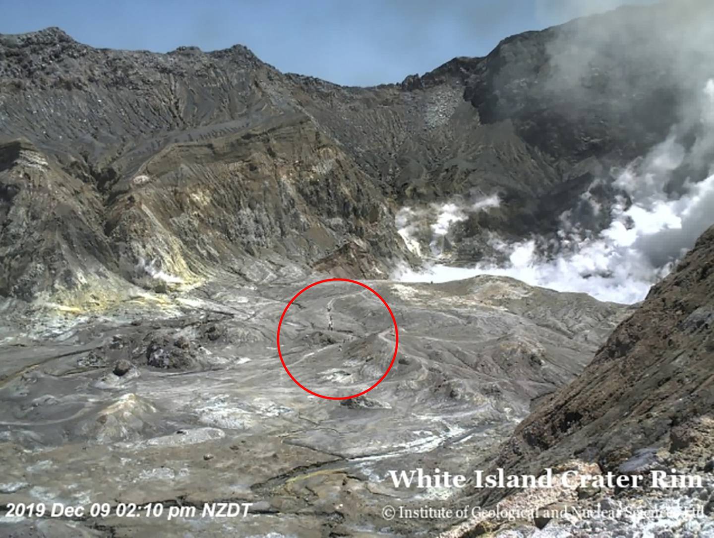 People can be seen inside the crater just before the eruption. Photo: GeoNet