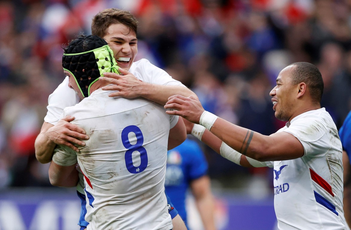 France's Gregory Alldritt celebrates scoring their third try with Antoine Dupont and Gael Fickou....