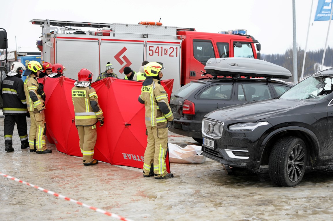 Firefighters secure the area after a woman and her daughter were killed when high winds tore the...