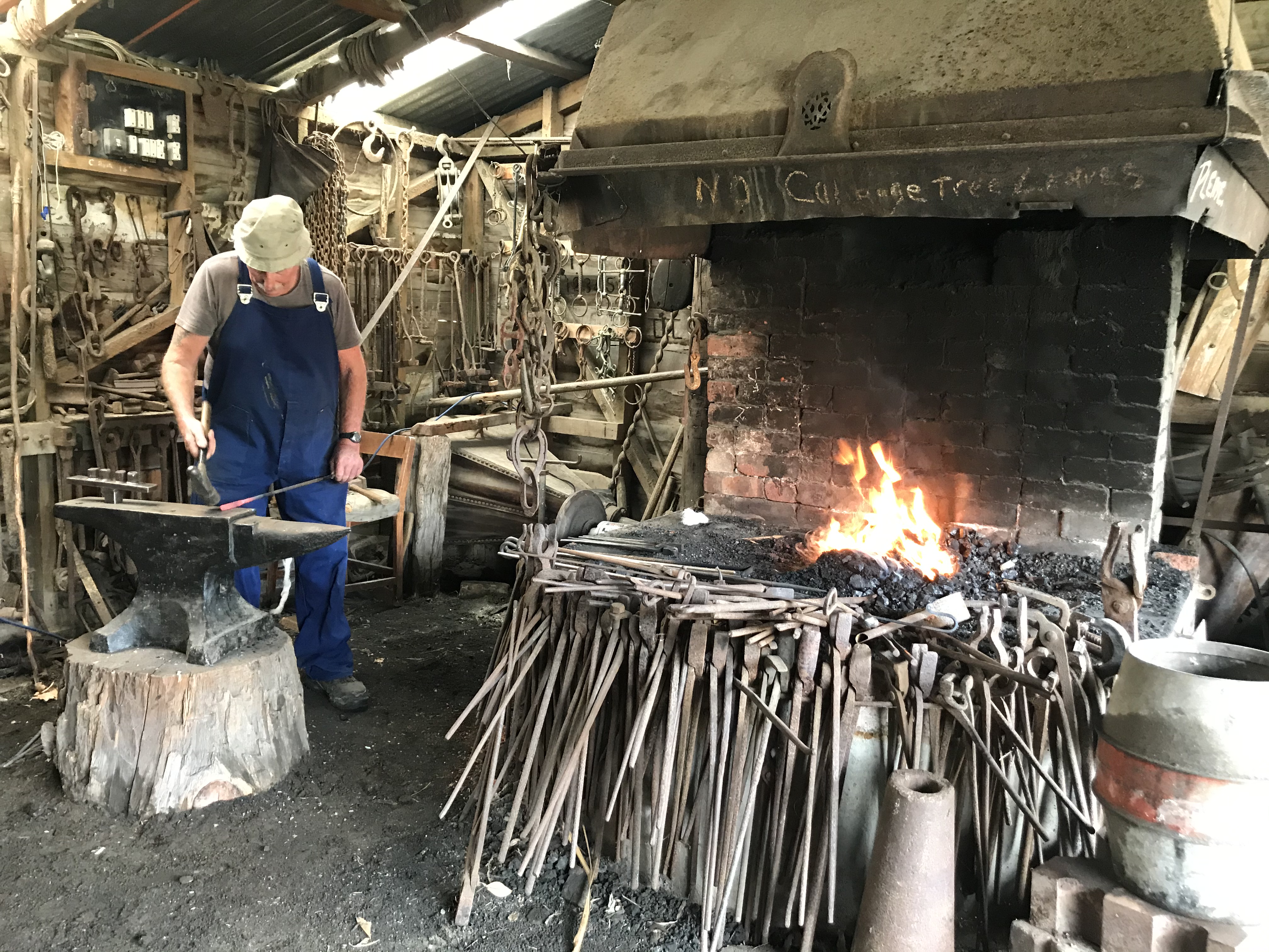 Blacksmith Les Schenkel at the Forge. Photo: Okains Bay Māori and Colonial Museum