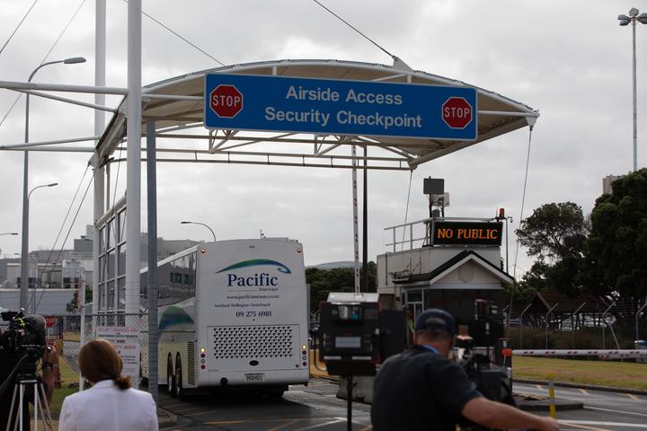 Buses arrive to collect passengers from the flight. Photo: RNZ