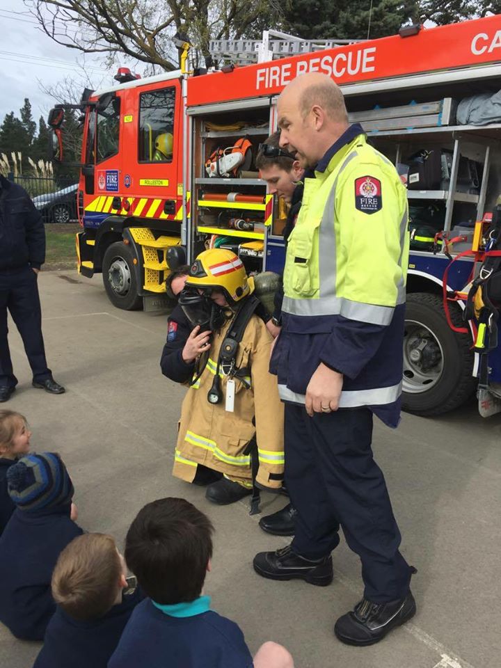 Cam Kenyon with Weedons School pupils helping them complete their fire-wise programme. Photo:...