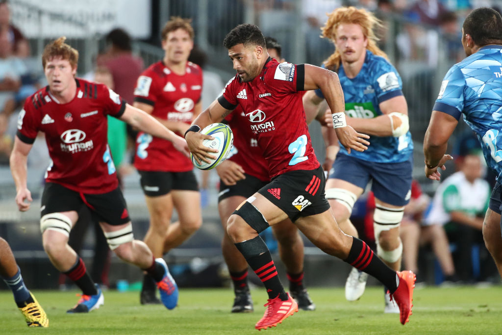 Richie Mo’unga of the Crusaders makes a break against the Blues. Photo: Getty