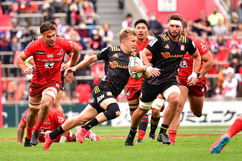 Damian Mckenzie goes on a run for the Chiefs against the Sunwolves. Photo: Getty Images