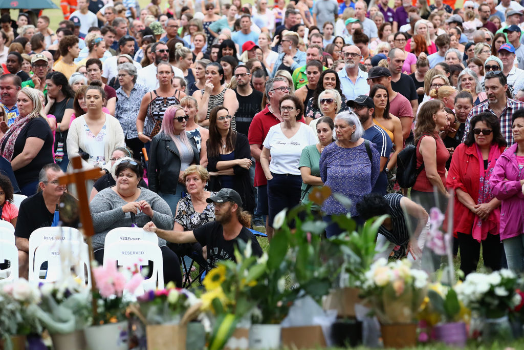 Mourners attend a vigil to remember Hannah Clarke and her three children at Bill Hewitt Reserve...