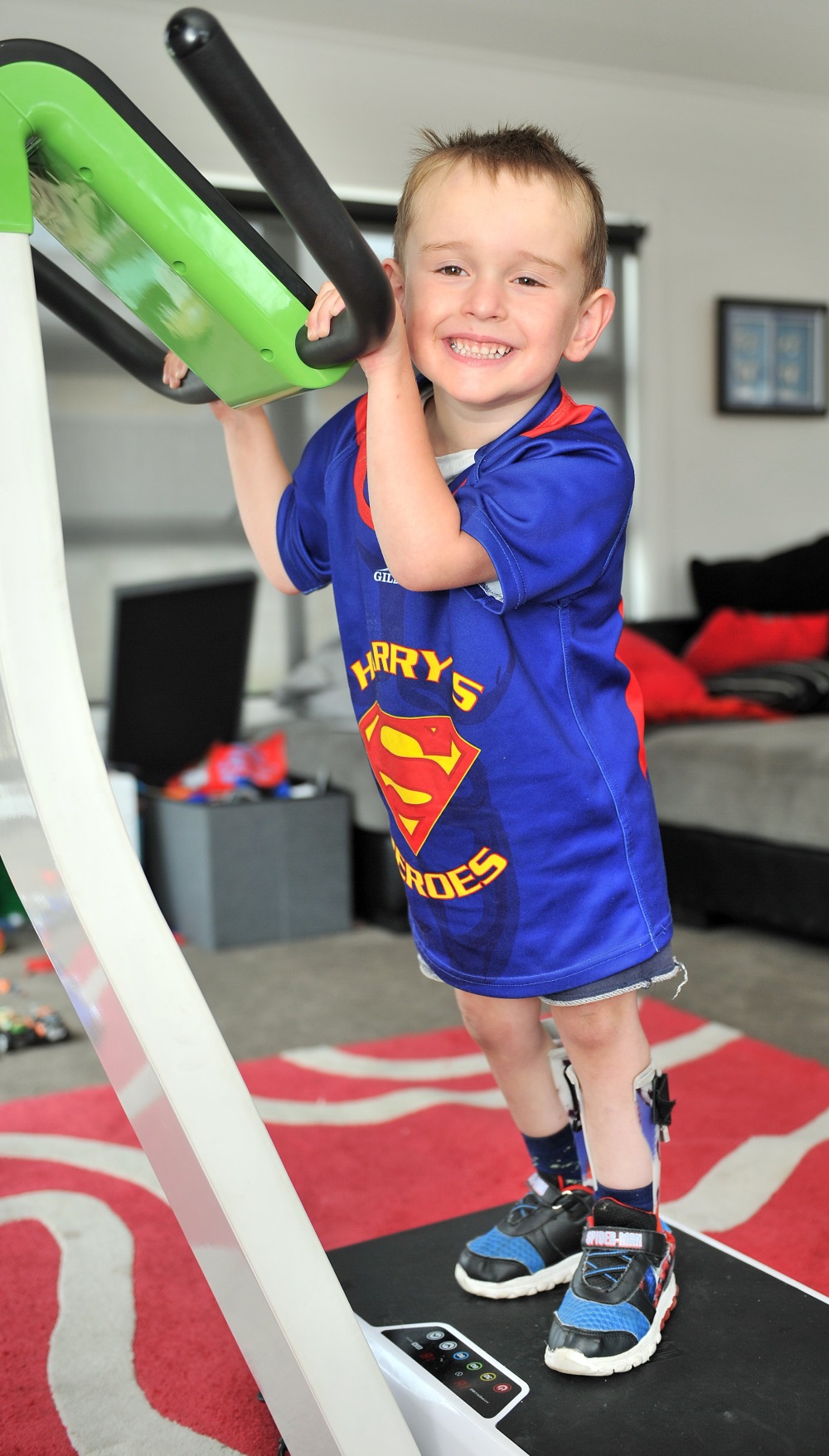 Harry Finch works on strengthening his legs on a vibration plate, as he prepares to start school...